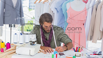 Fashion designer drawing on a desk