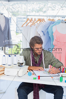 Fashion designer drawing clothes