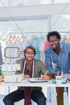 Handsome fashion designers looking at camera