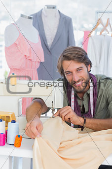 Fashion designer sewing