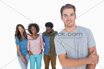 Handsome man gesturing in front of group of people