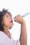 Pretty woman singing at karaoke
