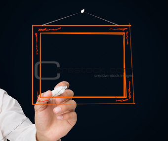 Businessman drawing picture frame
