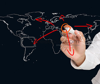 Businessman drawing world map with arrows