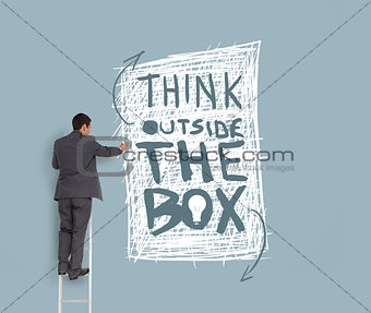 Businessman drawing think outside the box message