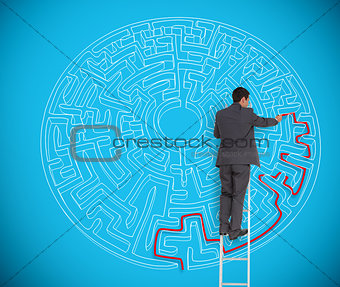Businessman drawing red line to solve a complex maze