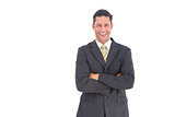 Laughing businessman with crossed arms