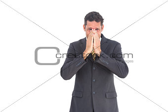 Apprehensive businessman looking at the camera
