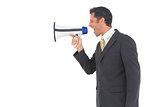 Side view of a businessman with a megaphone