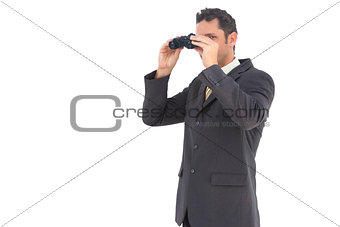 Handsome businessman with binoculars