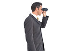 Businessman with binoculars looking on the right