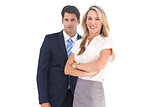 Businessman and woman looking at the camera