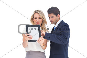 Business people looking at a pc tablet