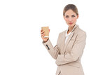 Businesswoman looking at the camera with coffee cup