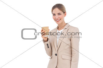 Smiling businesswoman holding a coffee cup
