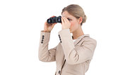 Businesswoman looking away with binoculars