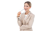 Smiling businesswoman holding glasses