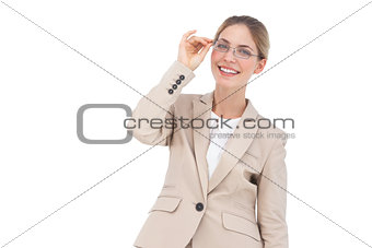 Smiling businesswoman holding her glasses