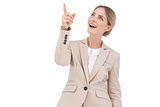 Smiling businesswoman pointing something