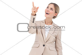 Smiling businesswoman pointing something
