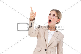 Surprised businesswoman pointing something
