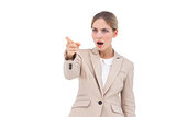 Confused businesswoman pointing something