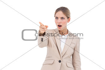 Confused businesswoman pointing something