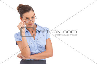 Smiling businesswoman adjusting her glasses