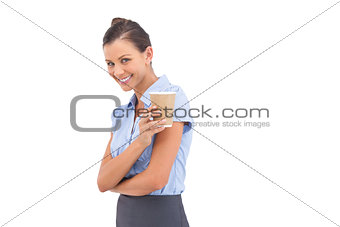 Laughing businesswoman holding coffee cup