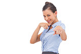 Smiling businesswoman pointing something with fingers