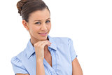 Smiling businesswoman with hand on chin