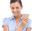 Smiling businesswoman with arms crossed and coffee cup