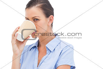 Pretty businesswoman drinking coffee