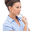 Concentrating businesswoman with pen