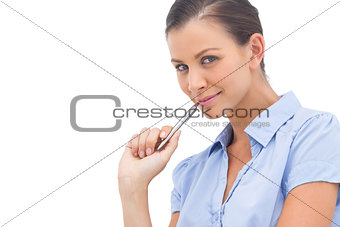 Smiling businesswoman with pen