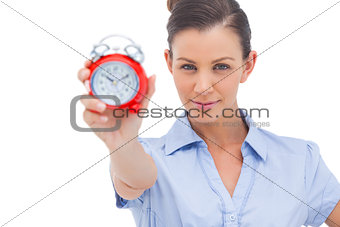 Businesswoman showing alarm clock