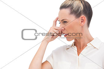 Confused businesswoman with hand on forehead