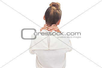 Businesswoman with hand on her neck