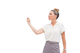 Businesswoman holding her hand up and looking up