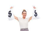 Smiling businesswoman carrying money bags