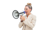 Angry businesswoman using megaphone