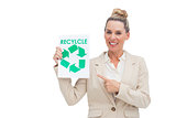 Smiling businesswoman promoting recycling and environment
