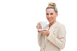 Smiling businesswoman holding a cup