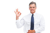 Mature businessman saying ok with hand