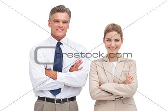 Mature businessman standing with his coworker