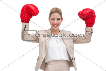 Smiling businesswoman with boxing gloves