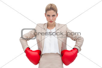 Determined businesswoman with boxing gloves