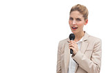 Frowning businesswoman with microphone