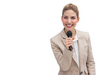 Smiling businesswoman holding microphone