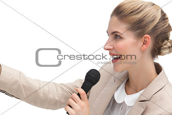 Side view of businesswoman with microphone